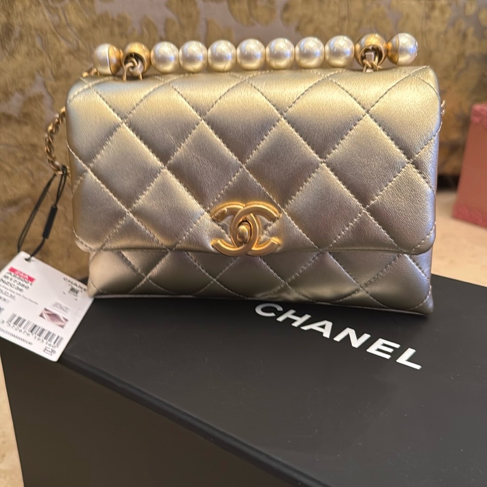 NWT CHANEL MINI QUILTED LAMBSKIN FLAP BAG WITH PEARL TOP HANDLE.  ALSO CROSSBODY